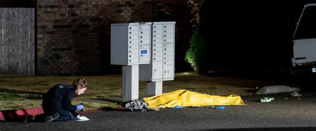 nvestigators work near a tarpaulin covering the body of a man who is reportedly Michael Forest Reinoehl after he was shot and killed by law enforcement on September 3, 2020, in Lacey, Washington. Reinoehl was being investigated by law enforcement for his role in a fatal shooting at a pro-trump rally in Portland on Saturday.