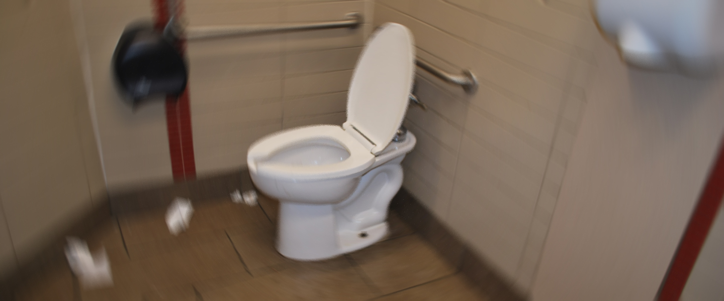in man pissing toilet