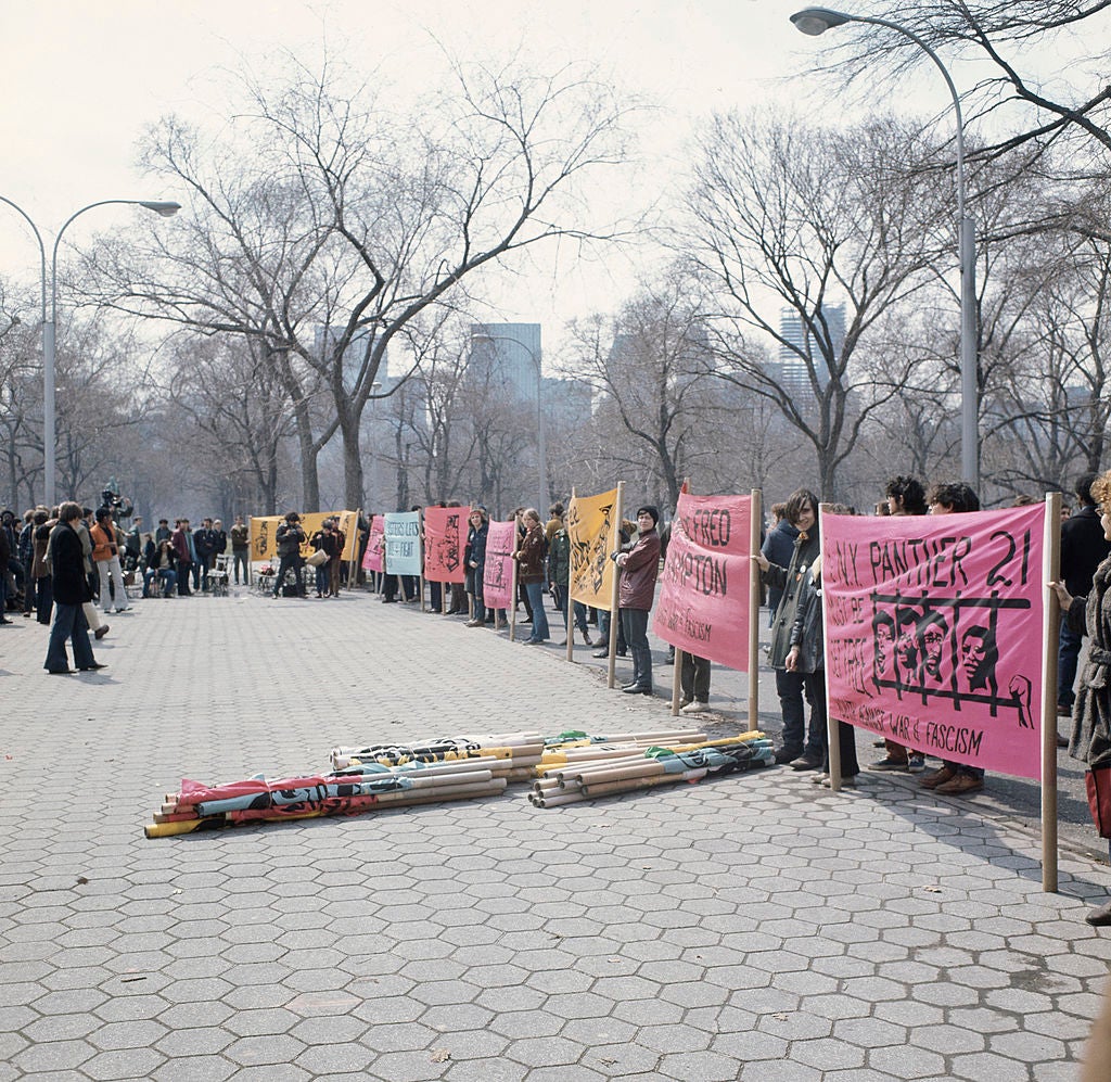 Demonstrators protesting in support of the Black Panther Party, USA, circa 1970. Their banners refer to Chicago Black Panther leader Fred Hampton, who was killed by police